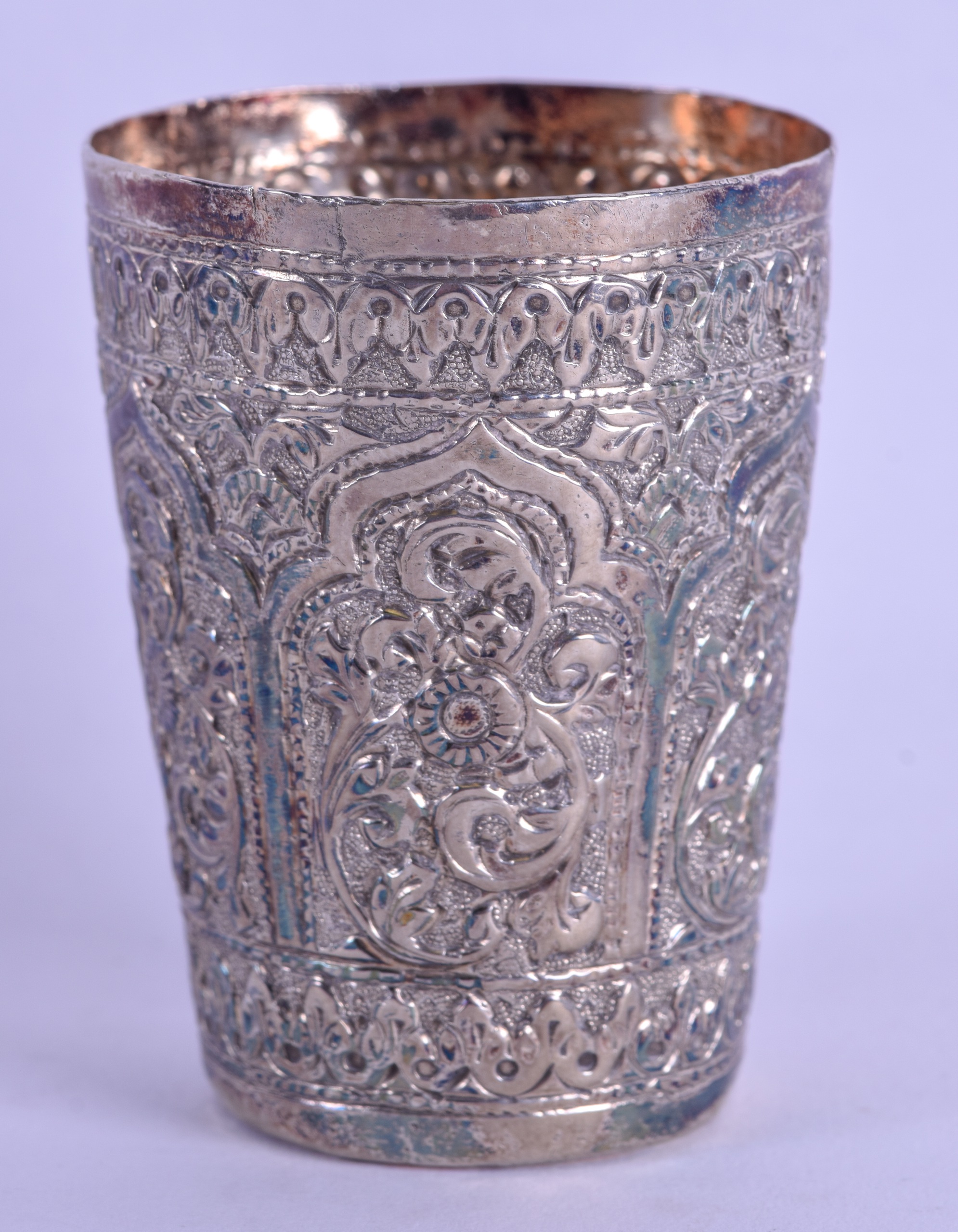 A LATE 19TH CENTURY INDIAN SILVER BEAKER decorated with foliage and vines. 2.4 oz. 6.75 cm high. - Image 2 of 3