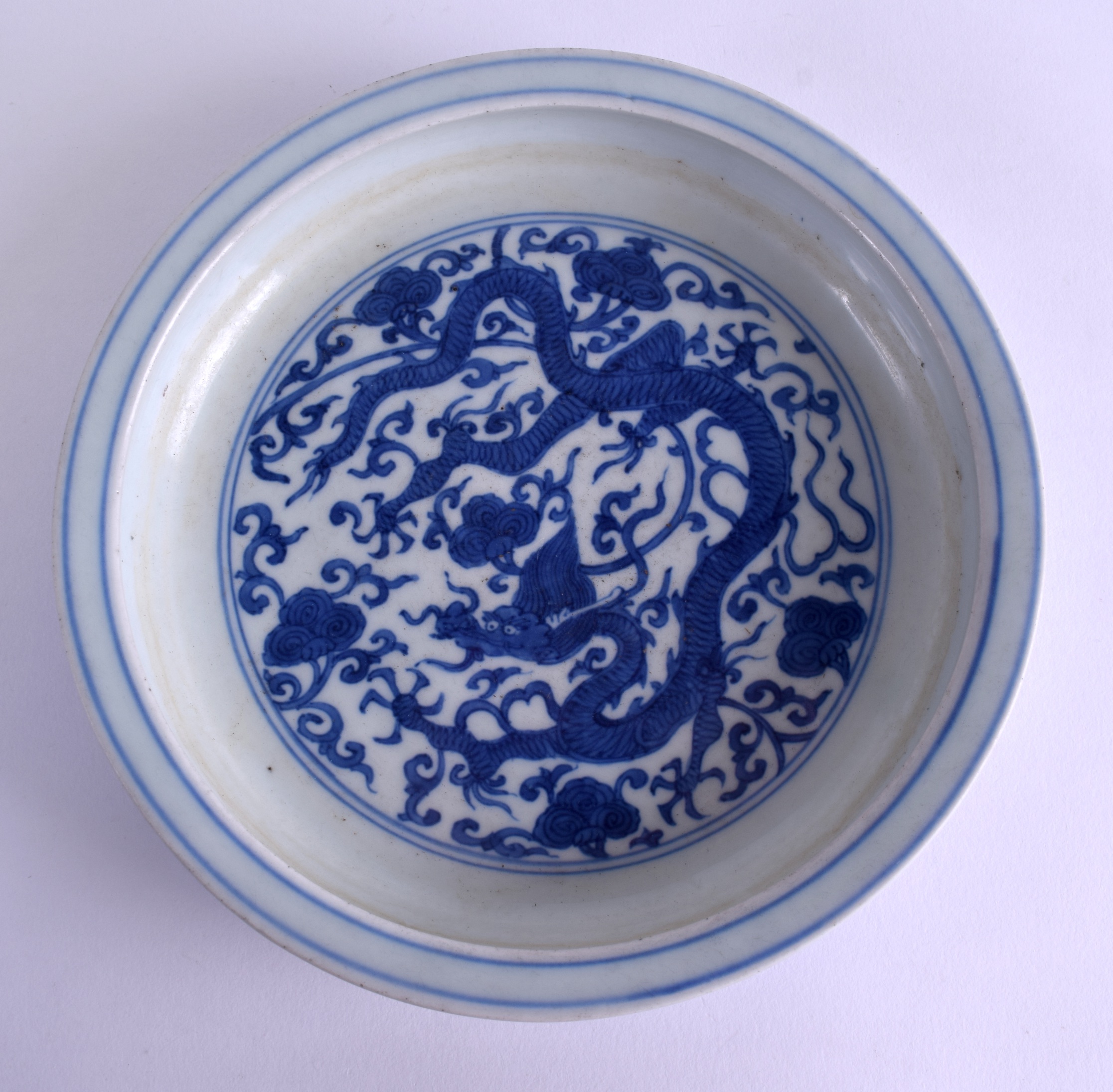 A 19TH CENTURY CHINESE BLUE AND WHITE PORCELAIN BRUSH WASHER bearing Ming marks to base, painted