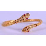 A GOOD HIGH CARAT GOLD DIAMOND AND RUBY SNAKE BANGLE tested as approx. 21ct. 55 grams. 7 cm x 6 cm.