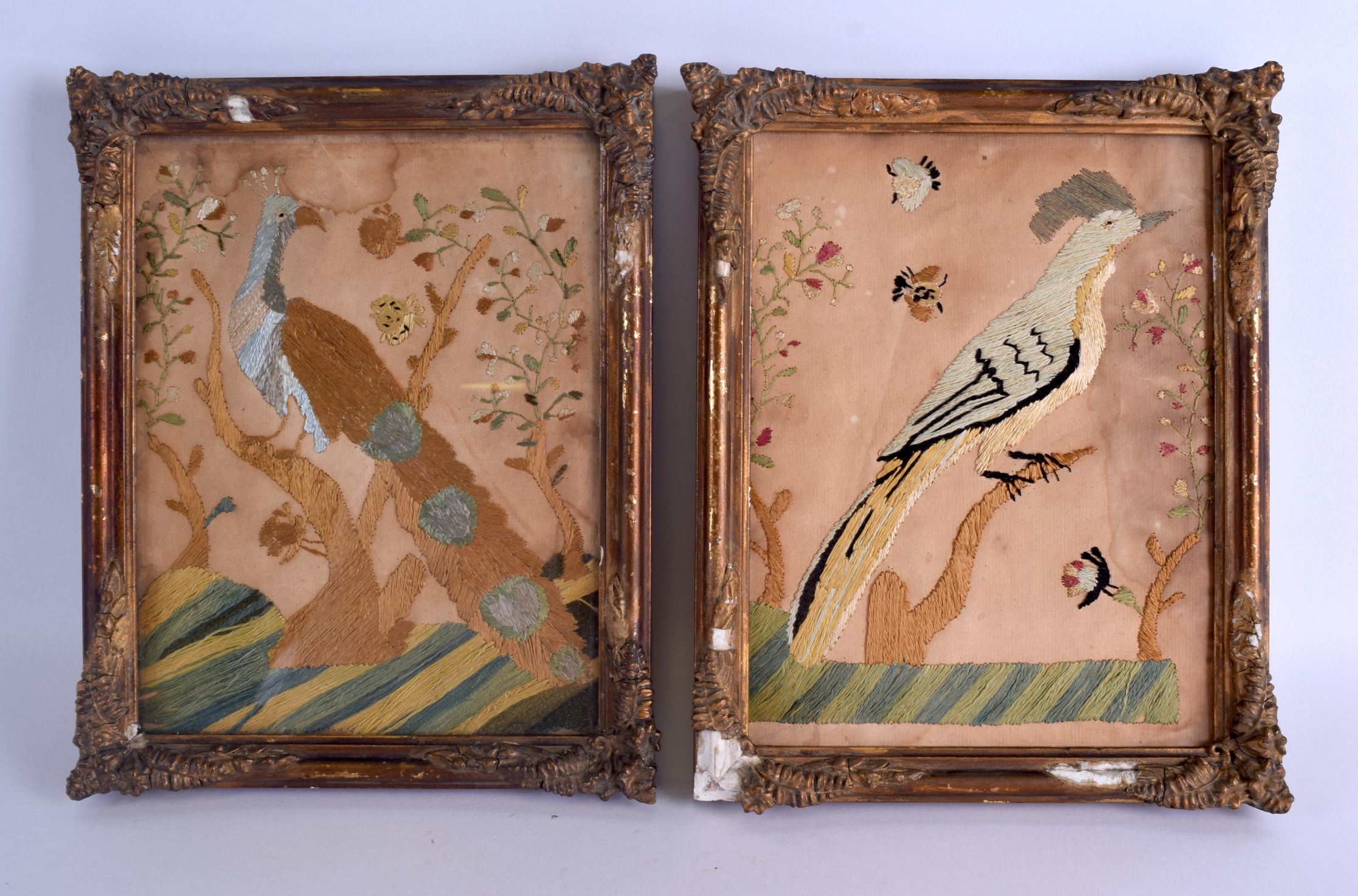 A PAIR OF 18TH CENTURY ENGLISH QUEEN ANNE EMBROIDERED PANELS depicting birds amongst foliage. Each