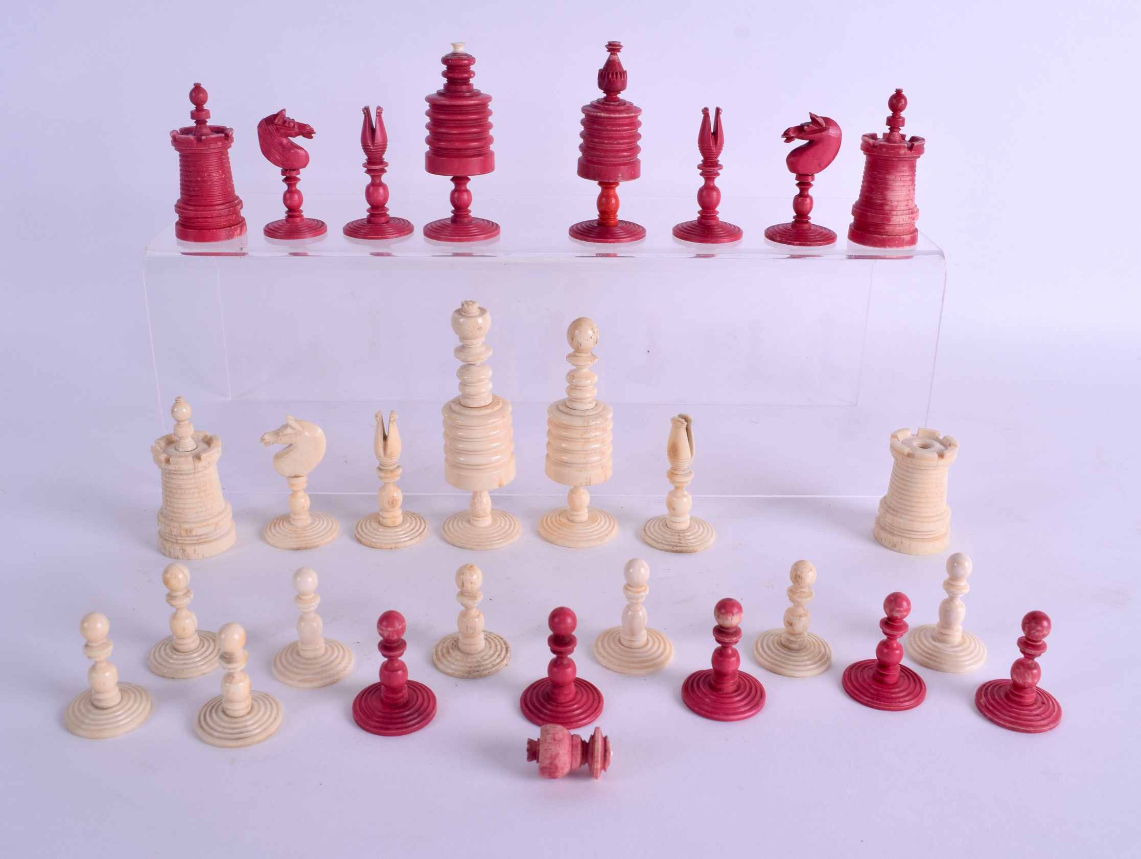 A 19TH CENTURY EUROPEAN CARVED AND STAINED IVORY CHESS SET. Largest 8.75 cm high. (qty)