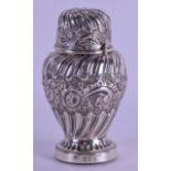 A LATE VICTORIAN EMBOSSED SILVER PEPPER POT. London 1892. 4 oz. 12 cm high.