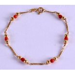 AN ELEGANT GOLD AND CORAL BRACELET. 2.6 grams. 14 cm long overall.