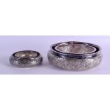 AN EARLY 20TH CENTURY MIDDLE EASTERN SILVER WATER HOLDER together with a smaller silver ring. 12.8