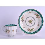 AN 18TH CENTURY WORCESTER GREEN ENAMELLED TEACUP AND SAUCER painted with gilt flowers in the