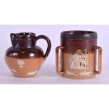 A MINIATURE DOULTON LAMBETH STONEWARE TYG together with another miniature Doulton jug. 4.25 cm high.