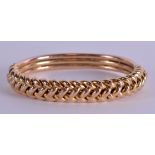 A VINTAGE 10CT GOLD ROPE TWIST BANGLE. 16 grams. 7 cm wide.