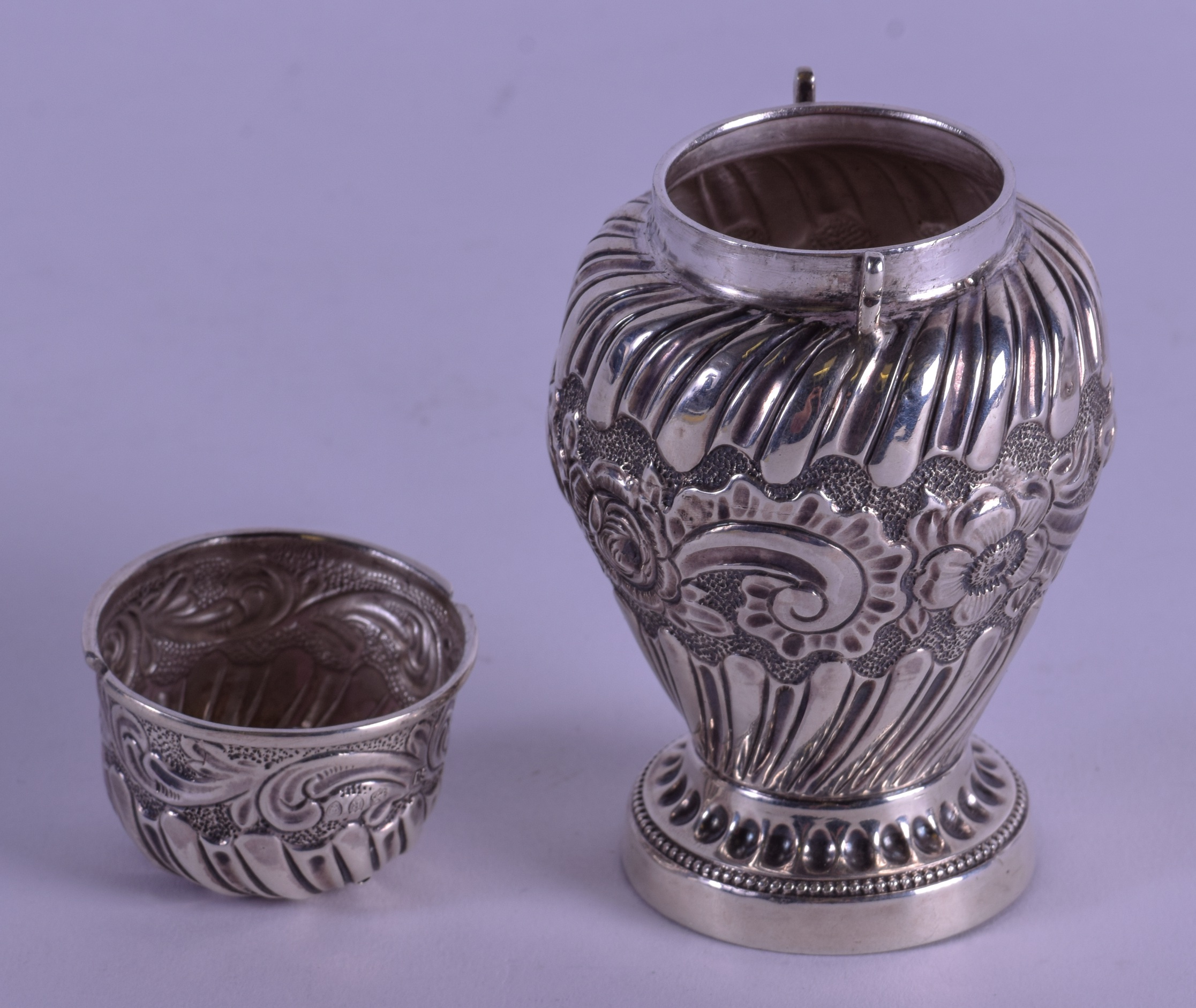 A LATE VICTORIAN EMBOSSED SILVER PEPPER POT. London 1892. 4 oz. 12 cm high. - Image 3 of 4