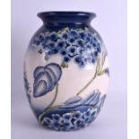 A LARGE MOORCROFT STYLE FLORIAN WARE VASE decorated with foliage. 23 cm high.