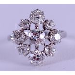 AN ANTIQUE WHITE GOLD AND DIAMOND CLUSTER RING of approx. 1.5cts. Size N. 4.2 grams.