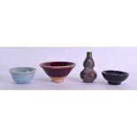 THREE CHINESE POTTERY BOWLS together with a Junyao glazed miniature vase. (4)