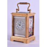 A MINIATURE SEVRES STYLE CARRIAGE CLOCK painted with porcelain panels of females. 7 cm high inc