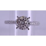 A 9CT GOLD DIAMOND SOLITAIRE RING. Size M.