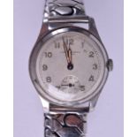 A VINTAGE J W BENSON STAINLESS STEEL WRISTWATCH. 3 cm diameter.