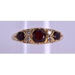 AN 18CT GOLD DIAMOND AND RUBY RING. 5 grams. Size N.