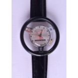 AN UNUSUAL HONDA STEERING WHEEL WRISTWATCH. Dial 2 cm diameter.