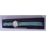 A MERCEDES BENZ WRISTWATCH, chrome dial and green cloth strap.Good Condition