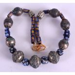 A 19TH CENTURY EUROPEAN CARVED GLASS EYE AND SILVER NECKLACE. 34 cm long.Tarnishing and wear