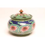 A SHELLEY, FOLEY INTARSIO EARTHENWARE JAR AND COVER, c.1920, of squat baluster form, printed and
