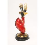 A MURANO GLASS FLAMENCO DANCER, mid 20th century, wearing an amber frilled black top and red skirt
