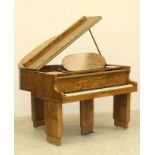 AN ART DECO BABY GRAND PIANO by B. Squire, the walnut case with oval music stand and raised on