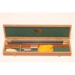 A HOLLAND & HOLLAND CASED SHOTGUN CLEANING KIT, with rod, three screw cut head fittings and