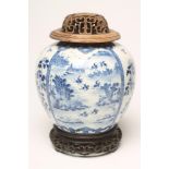 A CHINESE PORCELAIN JAR of ovoid form, painted in underglaze blue with two panels, each enclosing