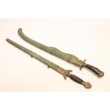 A CHINESE SWORD, with 20 1/2" curved and fullered blade, shaped horn grip, shagreen scabbard and