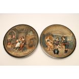 A PAIR OF MUSTERSCHUTZ EARTHENWARE PLAQUES, late 19th century, of dished circular form, modelled and