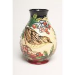 A MOORCROFT POTTERY VASE, 2004, of baluster form, tubelined and painted in bright colours with a