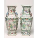 A PAIR OF CHINESE PORCELAIN VASES of inverted baluster hexagonal form with chi-long handles, painted
