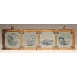 A SET OF FOUR DUTCH DELFT TILES, late 18th century, painted in blue, one with a vignette of an