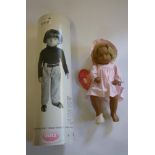 A Sasha doll "Victoria", No.0040214, 11 1/2" high with checked pink dress and hat, metal and hanging