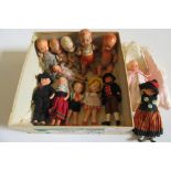 A collection of thirteen sprayed bisque jointed dolls house dolls including babies, boys and