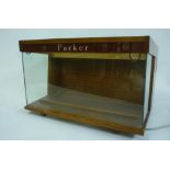 A Parker Pens counter display cabinet, c.1960, with mahogany frame, glazed top, front and sides,