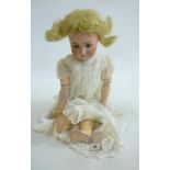 An Alt, Beck & Gottschalck bisque head doll with brown glass sleeping eyes, open mouth and teeth,