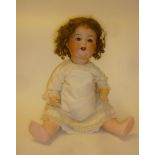 An Armand Marseille bisque head character doll with blue glass sleeping eyes, open mouth, teeth