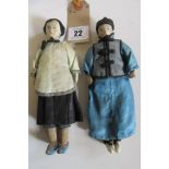 A pair of silk costume dolls with painted features, black silk hair on stitched cotton stiff