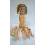 A Kestner bisque head doll with blue glass sleeping eyes, open mouth and teeth, (later) blonde