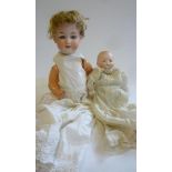An Armand Marseille bisque head "Dream Baby" doll with blue glass sleeping eyes, closed mouth,