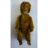 A Shuco monkey perfume bottle, pre-war, covered in dark gold plush with swivel joints and felt