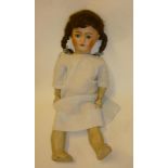 A Simon & Halbig bisque head girl doll with blue glass sleeping eyes, open mouth and teeth, brown