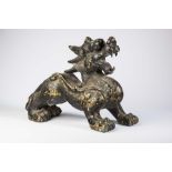 A CHINESE BRONZE TEMPLE DOG standing with open mouth and scroll moulded body, 18 1/2" high (Est.