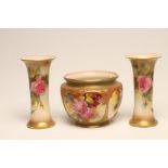 A PAIR OF ROYAL WORCESTER CHINA VASES, 1919, of waisted cylindrical form, painted in polychrome