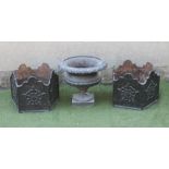 A PAIR OF CAST IRON PLANTERS, 20th century, of hexagonal form with wavy rim, the sides with a