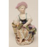 A MEISSEN PORCELAIN FIGURE, late 19th century, allegorical of Autumn, modelled as a young girl