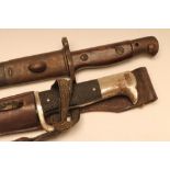 A GERMAN DRESS BAYONET, with 9 7/8" blade bearing Eickhorn twin squirrel mark, officer's knot,