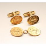 A PAIR OF LATE VICTORIAN 18CT GOLD CUFFLINKS, the oval panels engraved with a monogram on pivoting