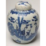 A CHINESE PORCELAIN JAR AND COVER of ovoid form, painted in underglaze blue with a young boy playing