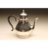 A SILVER TEAPOT, maker Elkington & Co., Birmingham 1935, in George II style of baluster form with
